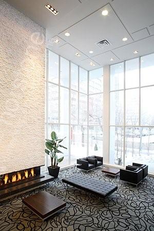 Norstone White Rock Panels on a multi story fireplace in the lobby of a boutique hotel in Canada